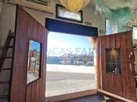 With character, on the seafront, old cave adapted to commercial premises for sale. Es Castell